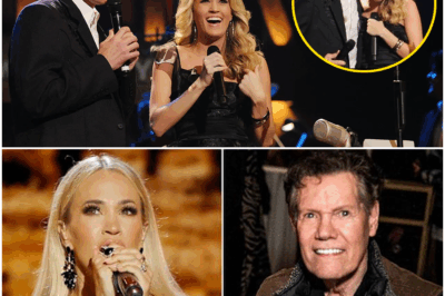 CARRIE UNDERWOOD HONORS RANDY TRAVIS IN EMOTIONAL GRAND OLE OPRY PERFORMANCE—“MUSIC HAS A WAY OF HEALING THE DEEPEST WOUNDS” In a heartwarming moment that left the country music world speechless, Carrie Underwood stepped onto the Grand Ole Opry stage to honor a legend who shaped her career—Randy Travis. “Music has a way of healing the deepest wounds,” Carrie softly shared before singing in tribute to the man whose voice first inspired her. The connection between them was far more than music—it was family. The moment reached its peak when Carrie handed Randy the microphone to sing his final “Amen,” despite the aftermath of his stroke, leaving the room in awe of a bond that transcends time and words.